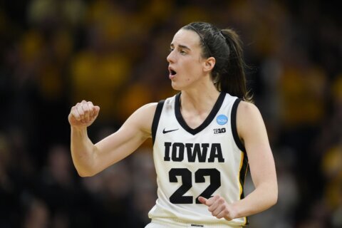 Clark scores 32 as top seed Iowa holds on to beat West Virginia 64-54