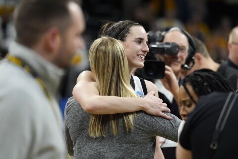 Iowa’s Clark shows love for the fans after they cheer her on one last time at Carver-Hawkeye Arena