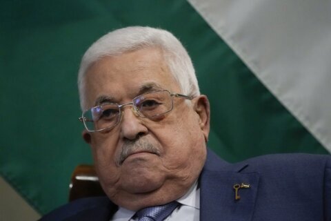 Palestinian leader appoints longtime adviser as prime minister in the face of calls for reform