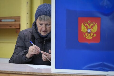 Russians cast ballots in an election preordained to extend President Vladimir Putin’s rule