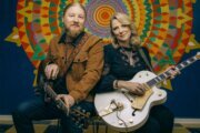 Derek Trucks and Susan Tedeschi pose with guitars. (David McClister)