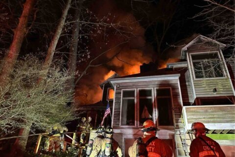 Fairfax Co. firefighters battle large fire that tore through house
