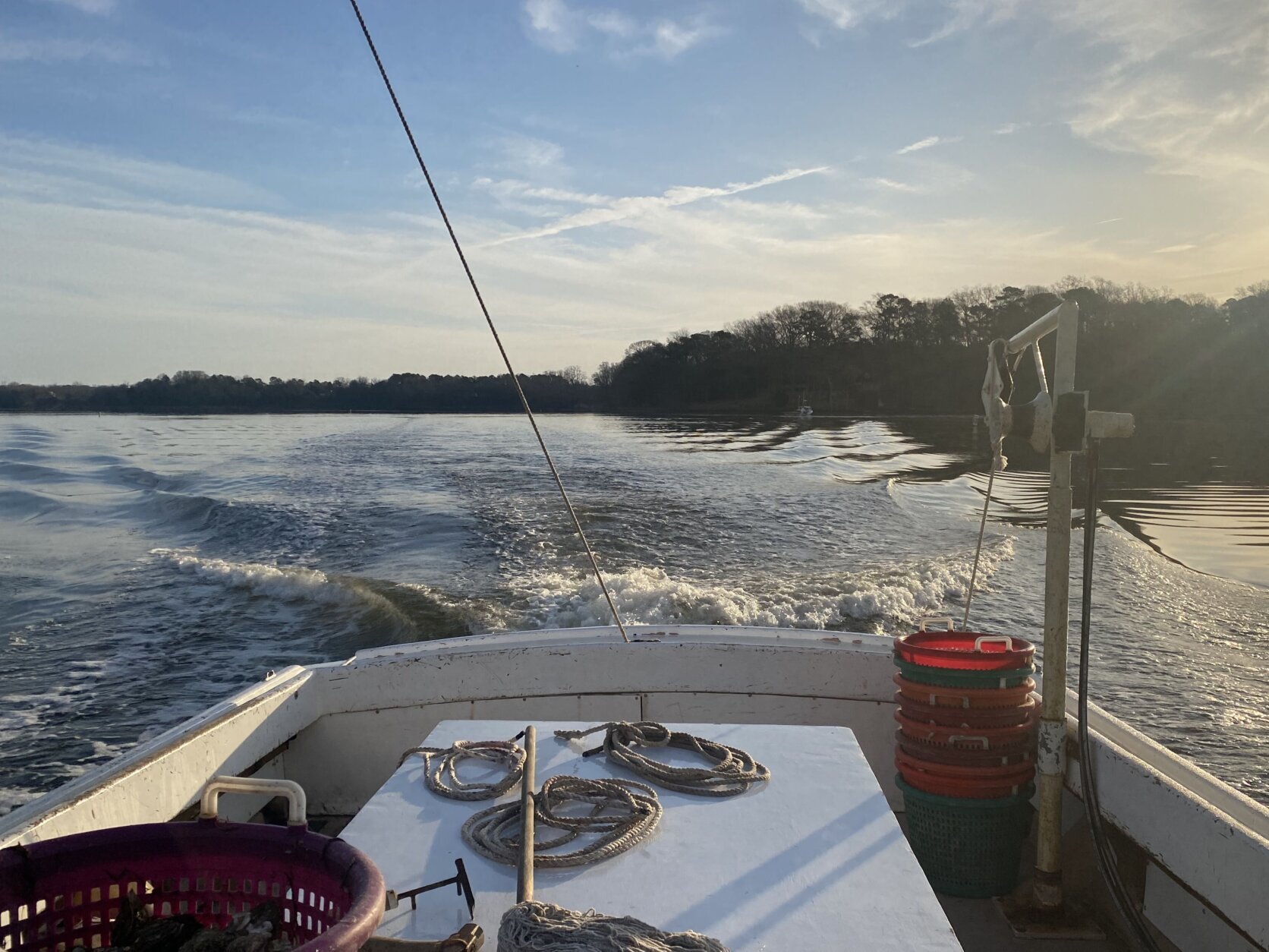 The back of a boat driving along Maryland's waterways.
