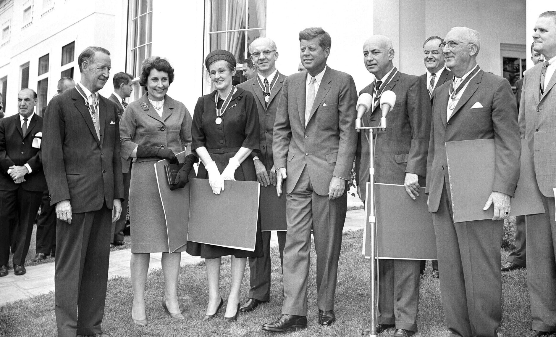 Dr. Frances Oldham Kelsey, third from left, the government medical officer who prevented the marketing of the drug Thalidomide in the United States, wears the distinguished Federal Civilian Service medal presented to her at the White House by President John F. Kennedy, center, Aug. 7, 1962. She said she was "impressed and overwhelmed." Others in the photo are unidentified. (AP Photo/John Rous)