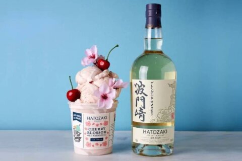 Cup of ice cream next to a bottle of alcohol