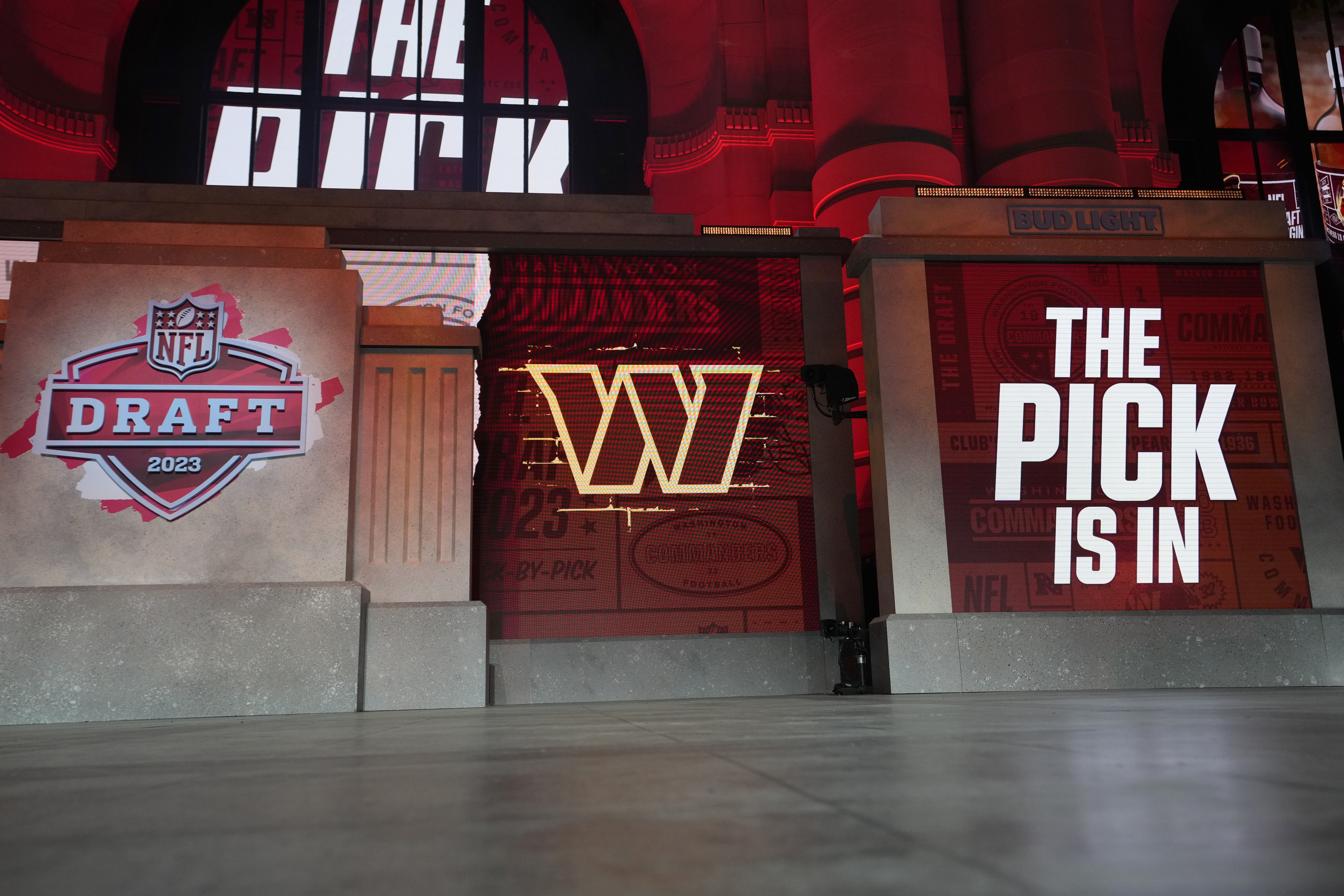 Onstage video screens display "The Pick Is In" for the Washington Commanders during the 2023 NFL Draft