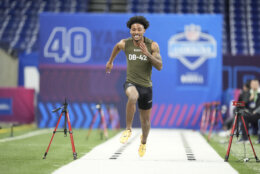 Clemson defensive back Nate Wiggins runs the 40-yard dash at the NFL football scouting combine, Friday, March 1, 2024, in Indianapolis. (AP Photo/Michael Conroy)