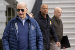 President Joe Biden, left, walks to speak with the media before boarding Marine One for departure from the South Lawn of the White House, Friday, April 5, 2024, in Washington. Maryland Gov. Wes Moore, and Lt. Gen. Scott Spellmon, Chief of Engineers and Commanding General of the U.S. Army Corps of Engineers, walk behind Biden who is headed to Maryland. (AP Photo/Alex Brandon)
