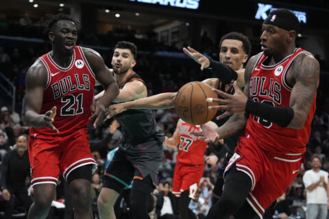 Rookie Adama Sanogo has 22 points and 20 rebounds to shatter career highs, Bulls top Wizards 129-127