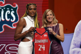 UConn's Aaliyah Edwards, left, poses for a photo with WNBA commissioner Cathy Engelbert after being selected sixth overall by the Washington Mystics during the first round of the WNBA basketball draft on Monday, April 15, 2024, in New York. (AP Photo/Adam Hunger)