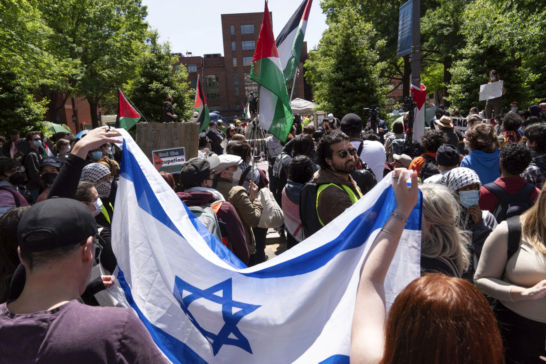 Israel supporters show up at George Washington University where students protest, during a pro-Palestinian protest over the Israel-Hamas war, Friday, April 26, 2024, in Washington. (AP Photo/Jose Luis Magana)