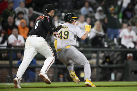 Brent Rooker hits a go-ahead double in the 10th to carry the Athletics past the Orioles 3-2