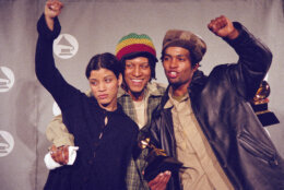 Members of the band Digable Planets, from left, Ladybug, Doodlebug and Butterfly, celebrate backstage after winning the Grammy for the best rap performance by a duo or group for "Rebirth of Slick," at the 36th Annual Grammy Awards ceremonies Tuesday, March 1, 1994, at the New York's Radio City Music Hall. (AP Photo/Mike Albans)