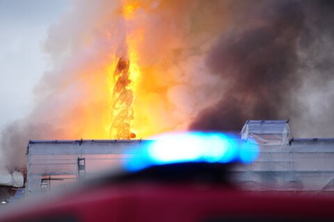 Fire destroys Copenhagen's Old Stock Exchange dating to 1600s, collapsing its dragon-tail spire