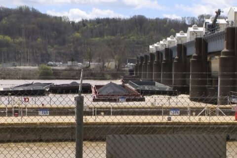Ohio River near Pittsburgh is closed as crews search for missing barge, one of 26 that broke loose