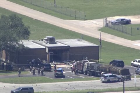 1 dead and 13 injured in semitrailer crash at a Texas public safety office, with the driver jailed