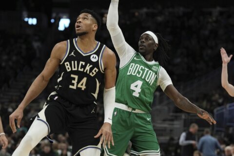 Antetokounmpo leaves Bucks' game with Celtics after grabbing his left calf while running up court