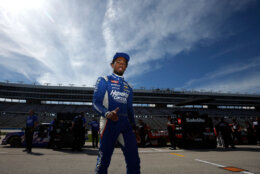 FORT WORTH, TEXAS - APRIL 12: Rajah Caruth, driver of the #71 HendrickCars.com Chevrolet, walks the grid during qualifying for the NASCAR Craftsman Truck Series SpeedyCash.com 250 at Texas Motor Speedway on April 12, 2024 in Fort Worth, Texas. (Photo by Sean Gardner/Getty Images)