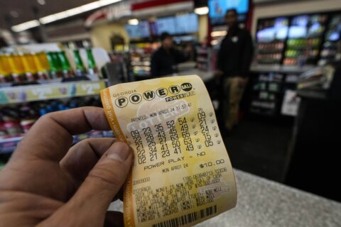 Powerball jackpot reaches $1.23B as long odds mean lots of losing, just as designed