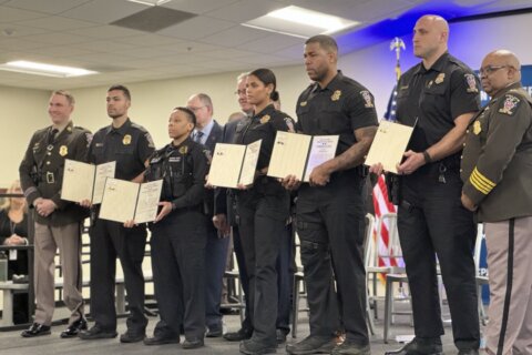 'They saved my life': Montgomery Co. police sergeant who lost legs in hit-and-run helps honor officers at awards ceremony