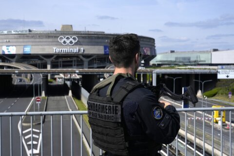 Massive policing for Paris Olympics to include security checks for some of the capital's residents