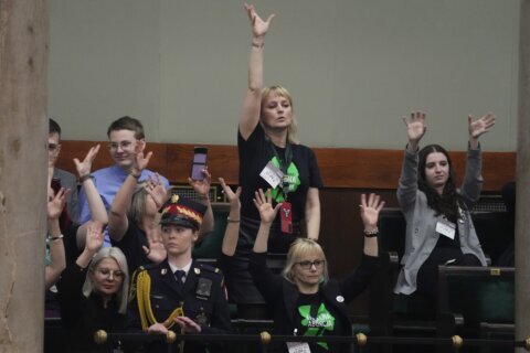 Polish lawmakers vote to move forward with work on lifting a near-total abortion ban