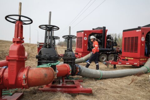 Rain, cooler temperatures help prevent wildfire near Canada’s oil sands from growing