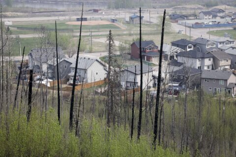 Fire threat eases near Canada's oil sands hub, but a long, hot summer looms
