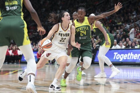 Jewell Loyd scores 32 before sellout of 18,000,  Seattle holds off Caitlin Clark and Fever 85-83