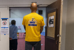 man waiting to vote