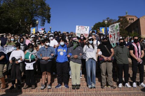 Hundreds of pro-Palestinian protesters remain  on UCLA campus despite police ordering them to leave