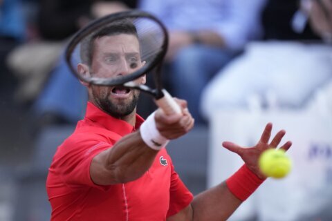 Djokovic wins his opener at the Italian Open after a month off. Defending champ Rybakina withdraws