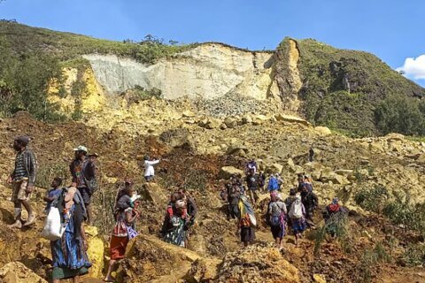 Papua New Guinea government says Friday’s landslide buried 2,000 people and formally asks for help