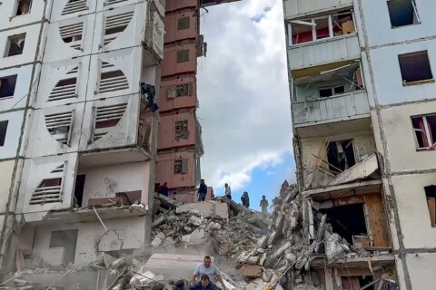 An apartment block collapses in a Russian border city after heavy shelling, injuring over a dozen