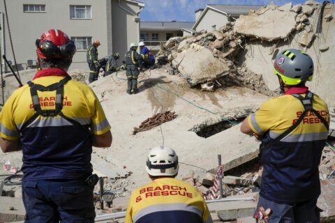 Death toll up to 32 in South Africa building collapse but rescue efforts boosted by 1 more survivor