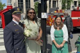 three people attending a memorial ceremony