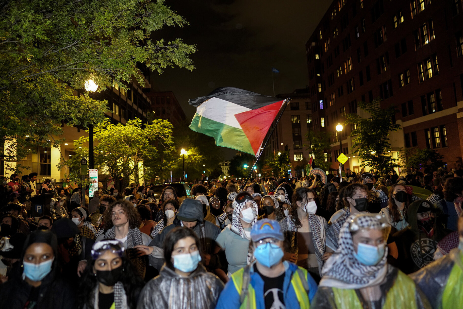 Pro-Palestinian demonstrators gather along H Street near the now fenced off University Yard at George Washington University on May 9, 2024 in Washington, DC. The Pro-Palestinian encampment that occupied GWU's University Yard for two weeks was cleared by police officers from the Metropolitan Police Department of the District of Columbia in the pre-dawn hours of May 8th, with more than 30 people being arrested, hours before D.C. (Photo by Kent Nishimura/Getty Images)