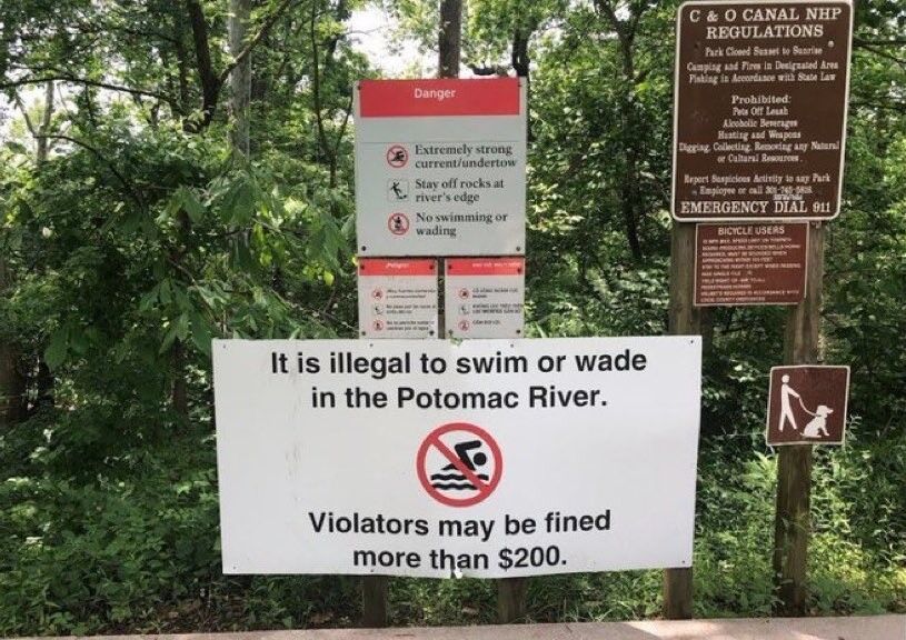 Sign in park saying swimming is illegal in Potomac River and violators could be fined more than $200