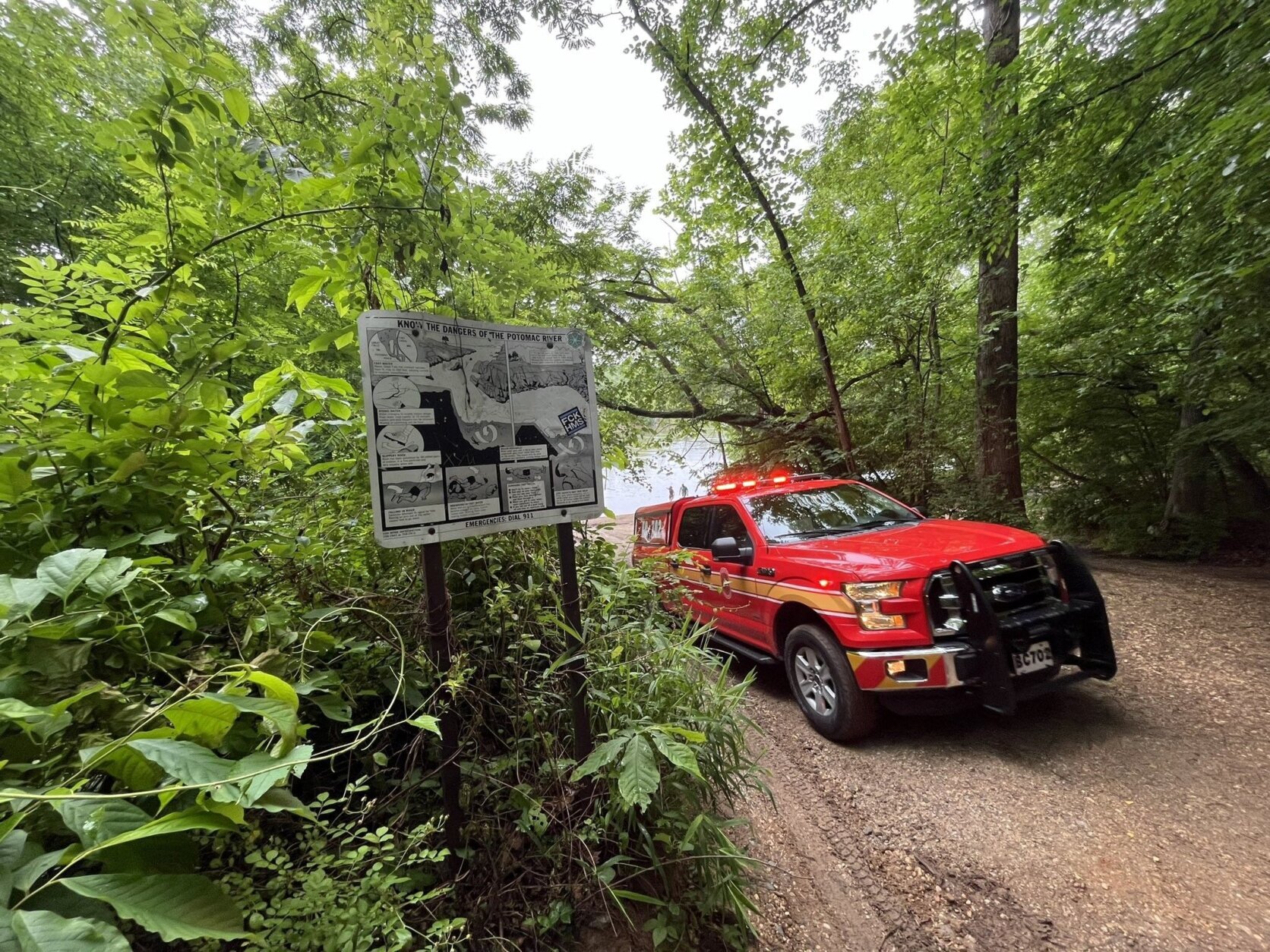 Rescue truck drives down dirt road