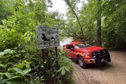 Rescue truck drives down dirt road