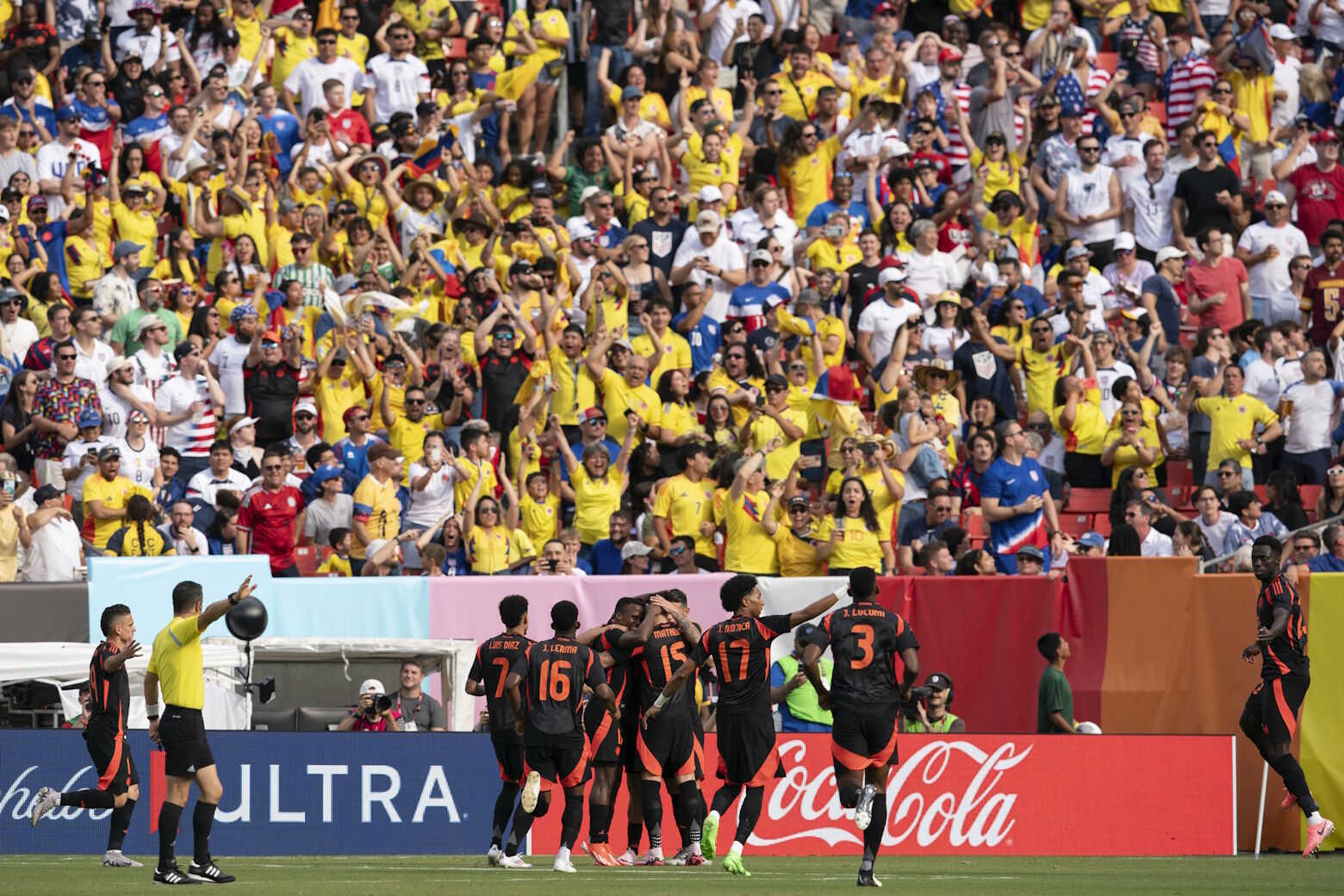 Colombia midfielder Jhon Arias, center with orange cleats, celebrates with his teammates after his goal against the United States during the first half of an international friendly soccer match Saturday, June 8, 2024, in Landover, Md. (AP Photo/Jose Luis Magana)