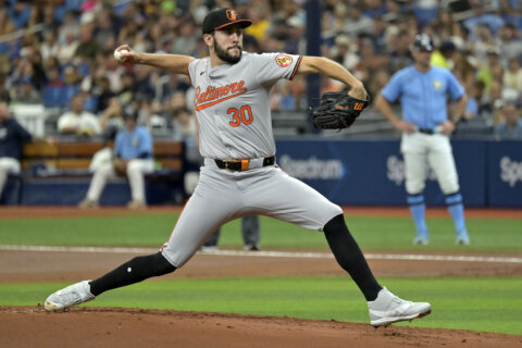 Rodriguez takes perfect game into the 6th, Rutschman has slam and drives in 6, Orioles beat Rays 9-2