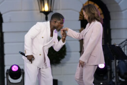 Gospel singer Kirk Franklin kisses Vice President Kamala Harris hand as he performs during a Juneteenth concert on the South Lawn of the White House in Washington, Monday, June 10, 2024. (AP Photo/Susan Walsh)