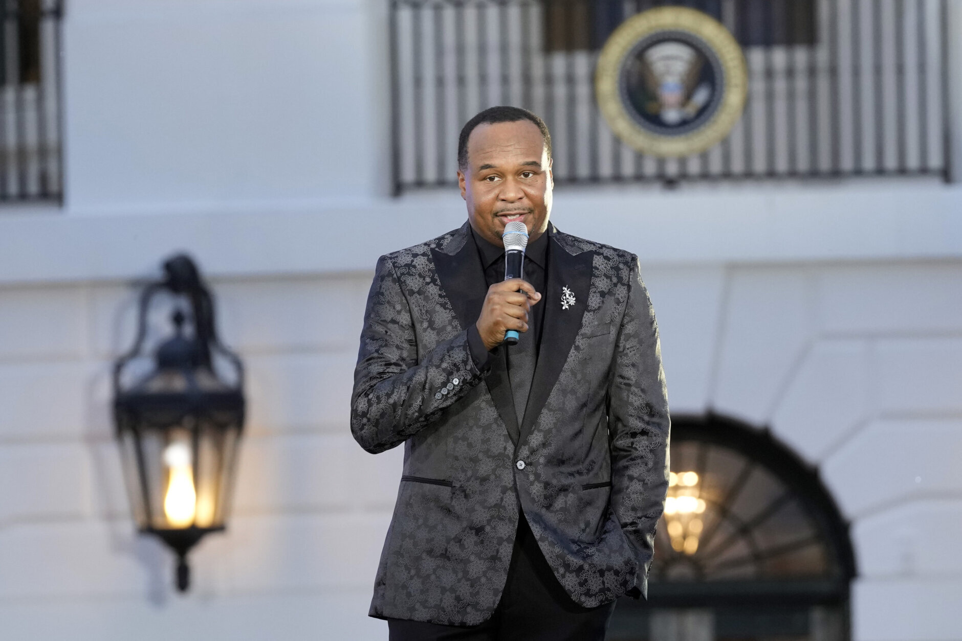 Emcee for the evening, comedian and actor Roy Wood, Jr. speaks during a Juneteenth concert on the South Lawn of the White House in Washington, Monday, June 10, 2024. (AP Photo/Susan Walsh)