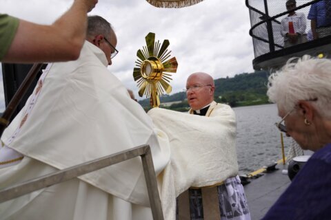 On heartland roads, and a riverboat, devout Catholics press on with two-month nationwide pilgrimage