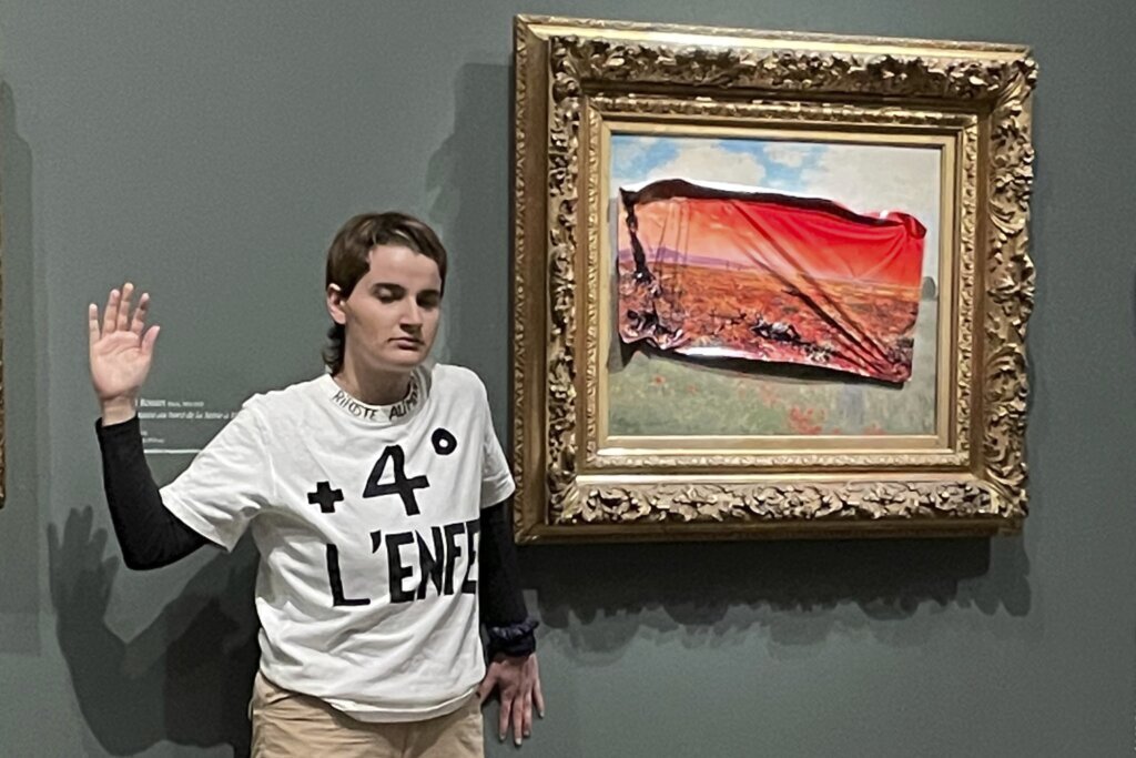 A climate activist in Paris stuck a protest poster on Monet’s ‘Poppy Field’