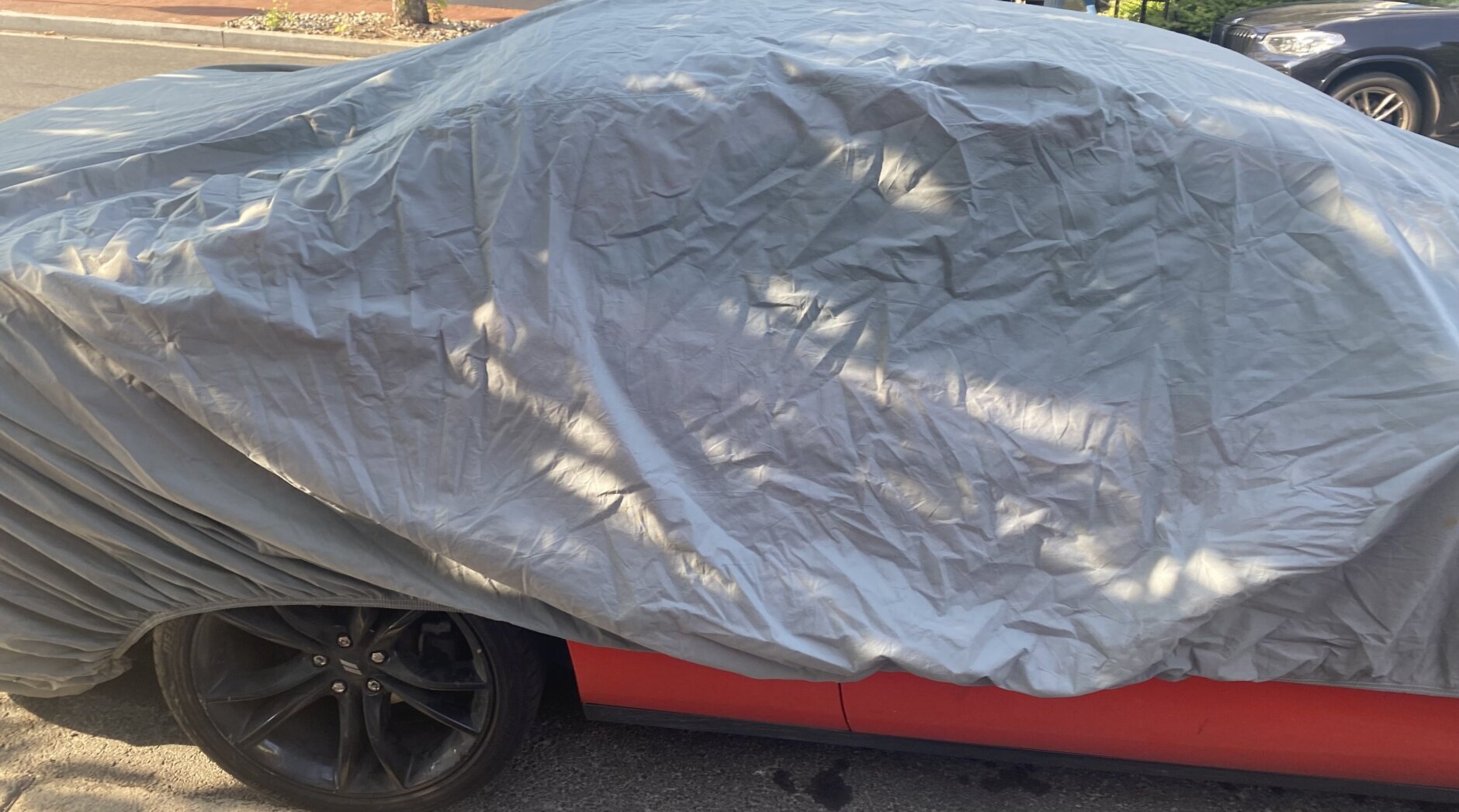 A vehicle with more than 40 unpaid tickets is seen under a cover in Northwest D.C.