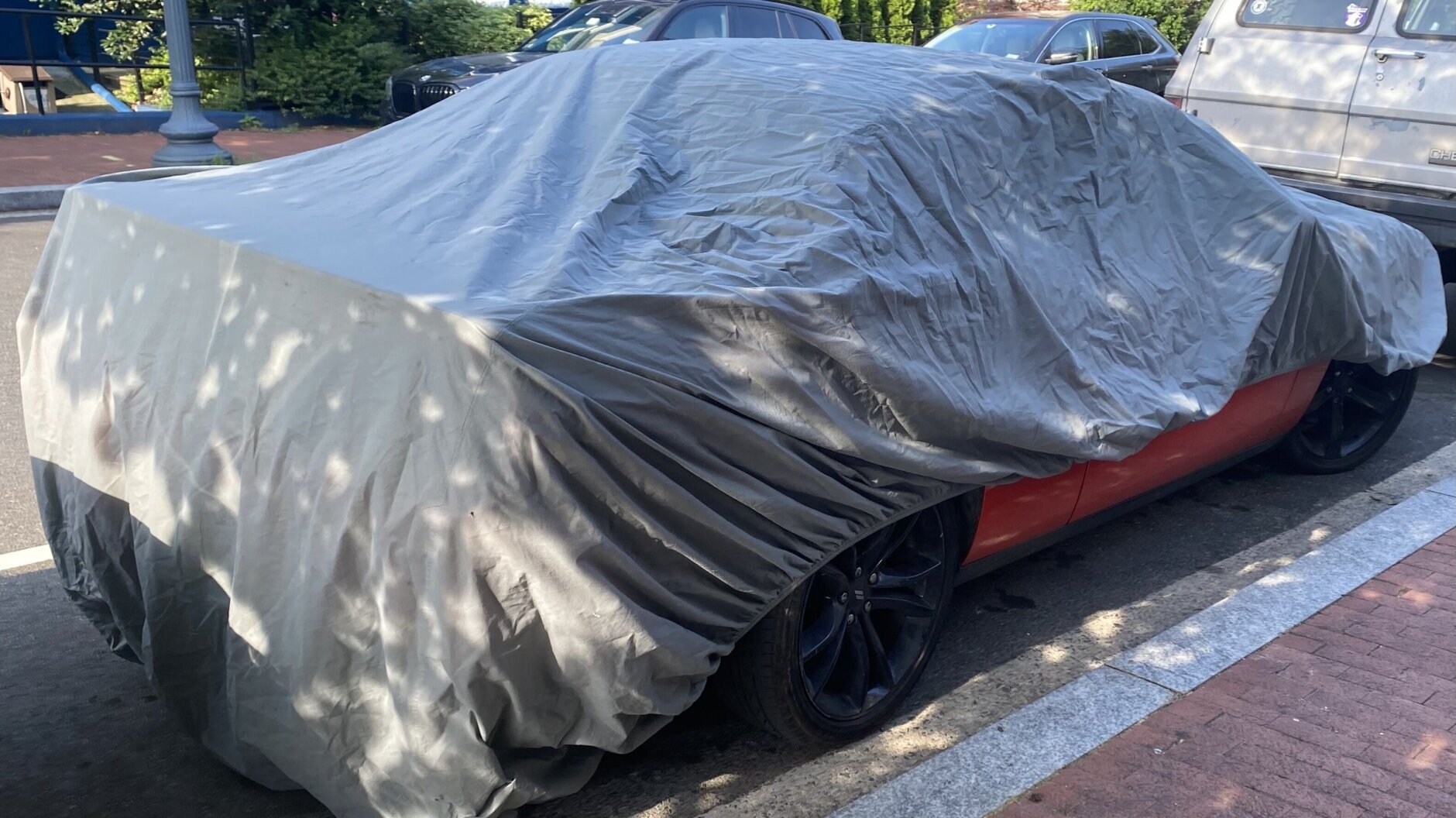 A vehicle with more than 40 unpaid tickets is seen under a cover in Northwest D.C.