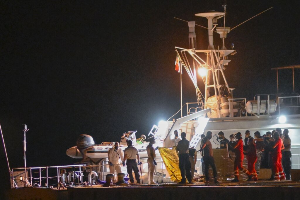 Italy’s coast guard searches for dozens of migrants missing after their ship capsized