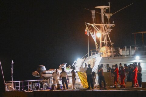 Italy's coast guard searches for dozens of migrants missing after their ship capsized